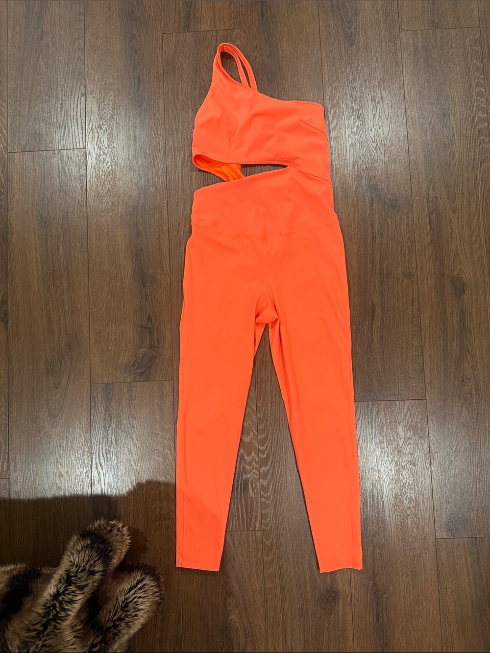FP Movenment Asymmetric Cutout Jumpsuit in Vibrant Orange